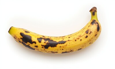 Ripe, spotted banana on white background