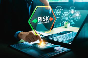 Business Professional Analyzing Risk Management Strategies with Digital Dashboard, Calculator, and...