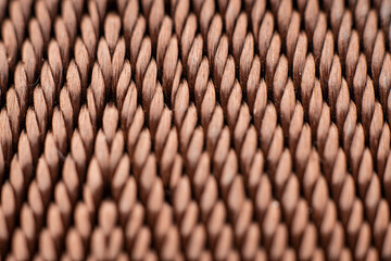 Textured brown fabric showcasing intricate weaving patterns in stylish retro design