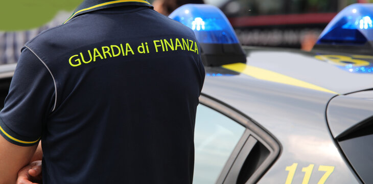 Vicenza, VI, Italy - June 2, 2022: Policeman with uniform and text GUARDIA DI FINANZA that means Financial Police in italian language  at checkpoint
