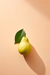 A Fresh Green Pear With Leaves On Counter Surface. Light Color Background, Natural Light and Shadow. Minimal Food Art Concept.