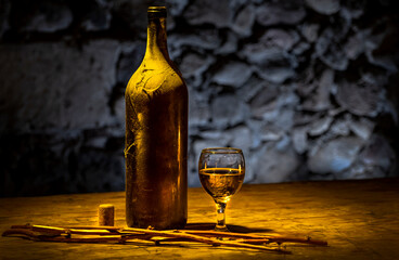 Bottle of white wine and a glass