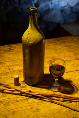 Bottle of white wine and a glass