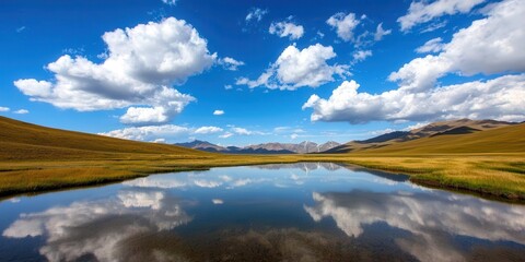 Obraz premium clean energy renewable marketing concept. Serene landscape with a clear blue sky and reflecting water.