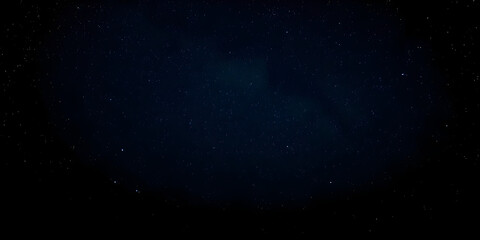 Fototapeta premium Night sky with stars sparkling on black background