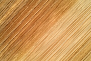 Harvested wheat field creating diagonal lines in aerial view
