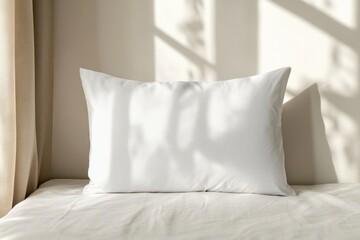 Soft White Pillow on a Light Bedspread with Gentle Shadow Play