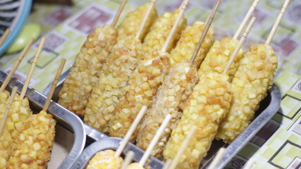 Close up of Potato Corn Dog snack sell at food outlet.