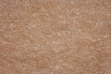 Old concrete wall background texture. Old grungy texture, yellow concrete wall
