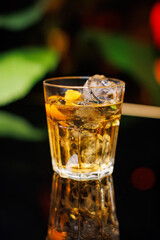 glass of whiskey with ice
