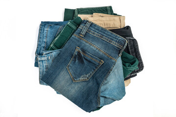 Blue and color jeans isolated on white background, jeans stacked, recycle, clipping path included
