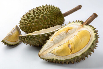 Fototapeta premium Fresh durian fruit, cut into halves, with durian pulp on a white background