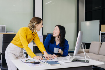 Fototapeta premium Diverse professionals collaborate on project analysis with financial graphs.