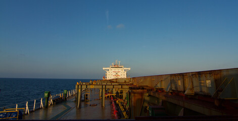 View of the main deck of a bulk carrier ship underway at sea