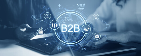 Obraz premium B2B network concept with digital icons and laptop on blue background.