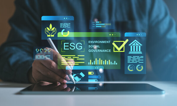 ESG investment strategy concept with holographic interface on tablet.