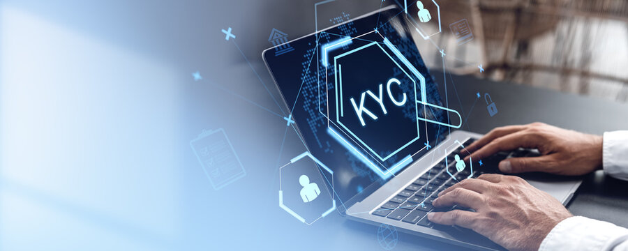KYC digital verification concept on a laptop screen with icons for identity and data security, highlighting client personal information safety.