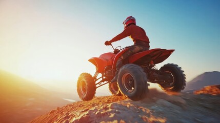 Fototapeta premium Adventurous ATV Rider on Steep Mountain Incline