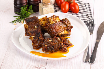Prepared tasty beef ribs with sauce