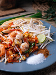 Pad Thai is a stir fry rice noodles with shrimp. Popular Thai street food.