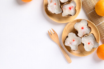 Sticky rice cake with coconut filling on white background with copy space, Chinese New Year cake