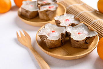 Sticky rice cake with coconut filling on white background, Chinese New Year cake