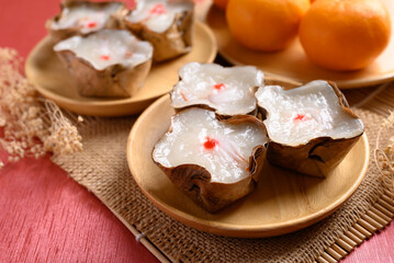 Sticky rice cake with coconut filling on red background, Chinese New Year cake
