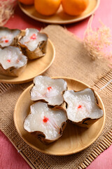 Sticky rice cake with coconut filling on red background, Chinese New Year cake