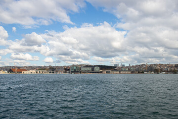 Fototapeta premium Istanbul cityscape, Islamic heritage by the water, transportation and boats at the dock.