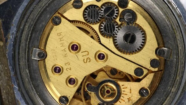 Clockwork mechanism rotates in a circle, looped video