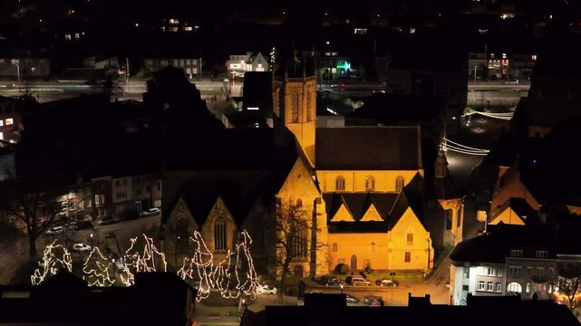 historical church dendermonde belgium night dark from context village close up aerial drone panning shot view close-up nighttime 