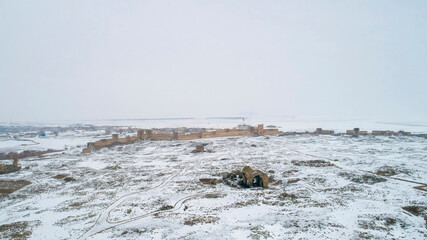 Ani Cathedral in the Ani Ruins in Kars, Turkey. Drone photo of the Ani Cathedral under the snow.