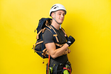 Young rock climber Brazilian man proud and self-satisfied
