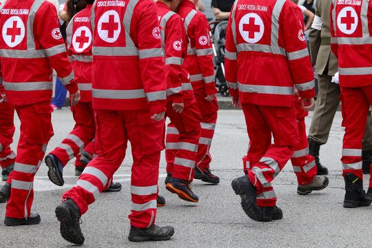 Vicenza, VI, Italy - June 2, 2022: parade of uniformed Red Cross rescuers walking on the road