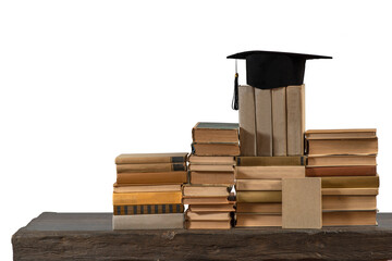Stacks of books, Square academic cap or graduation hat. Concept of education, knowledge,...