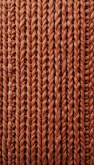 Naklejka premium Warm textured knit fabric showcasing interwoven patterns in soft hues