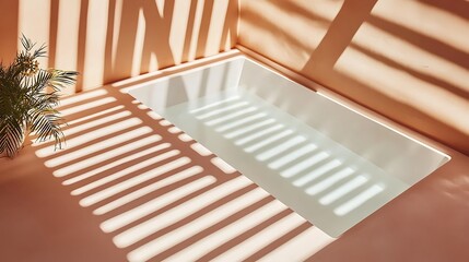 Naklejka premium Empty tub in peach room with shadows from plant. Relax