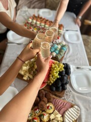 close up of a person holding a tray of food