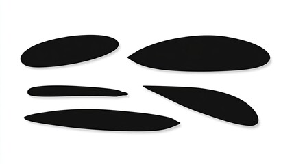 Set of simple, flat black silhouette shapes. Long oval shape with a pointy tip at one end and a rounded base on the other, against a blank background. High resolution. 