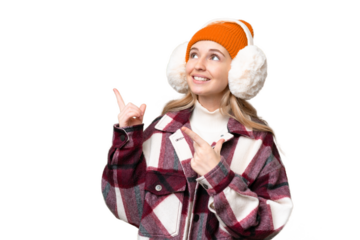 Young  English woman wearing winter muffs over isolated background pointing with the index finger a great idea