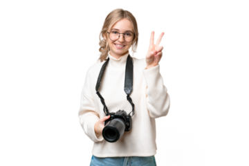 Young photographer English woman over isolated background smiling and showing victory sign