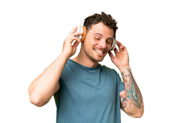 Brazilian man over isolated chroma key background listening music and singing © luismolinero