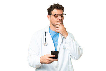 Brazilian doctor man over isolated chroma key background thinking and sending a message
