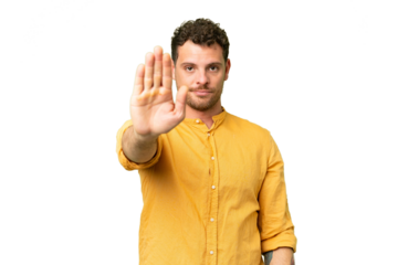 Brazilian man over isolated chroma key background making stop gesture