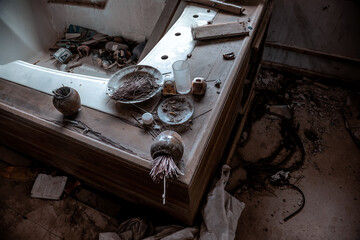 Old bathroom in an abandoned hotel. Dirty objects. Shabby walls.