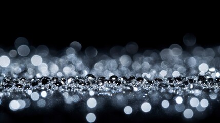 Fototapeta premium A high-resolution close-up of sparkling glitter on a black background
