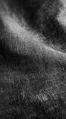 Gray burlap texture showcasing intricate weave patterns and subtle variations in tone