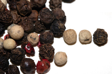 Close up of mixed pepercorn on white background