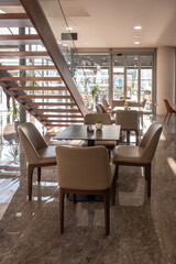 Interior of a modern restaurant. Dining area with contemporary furniture elegant tables and chairs