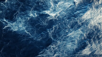 Obraz premium A textured abstract resembling a stormy ocean, with rough blue and gray brushstrokes